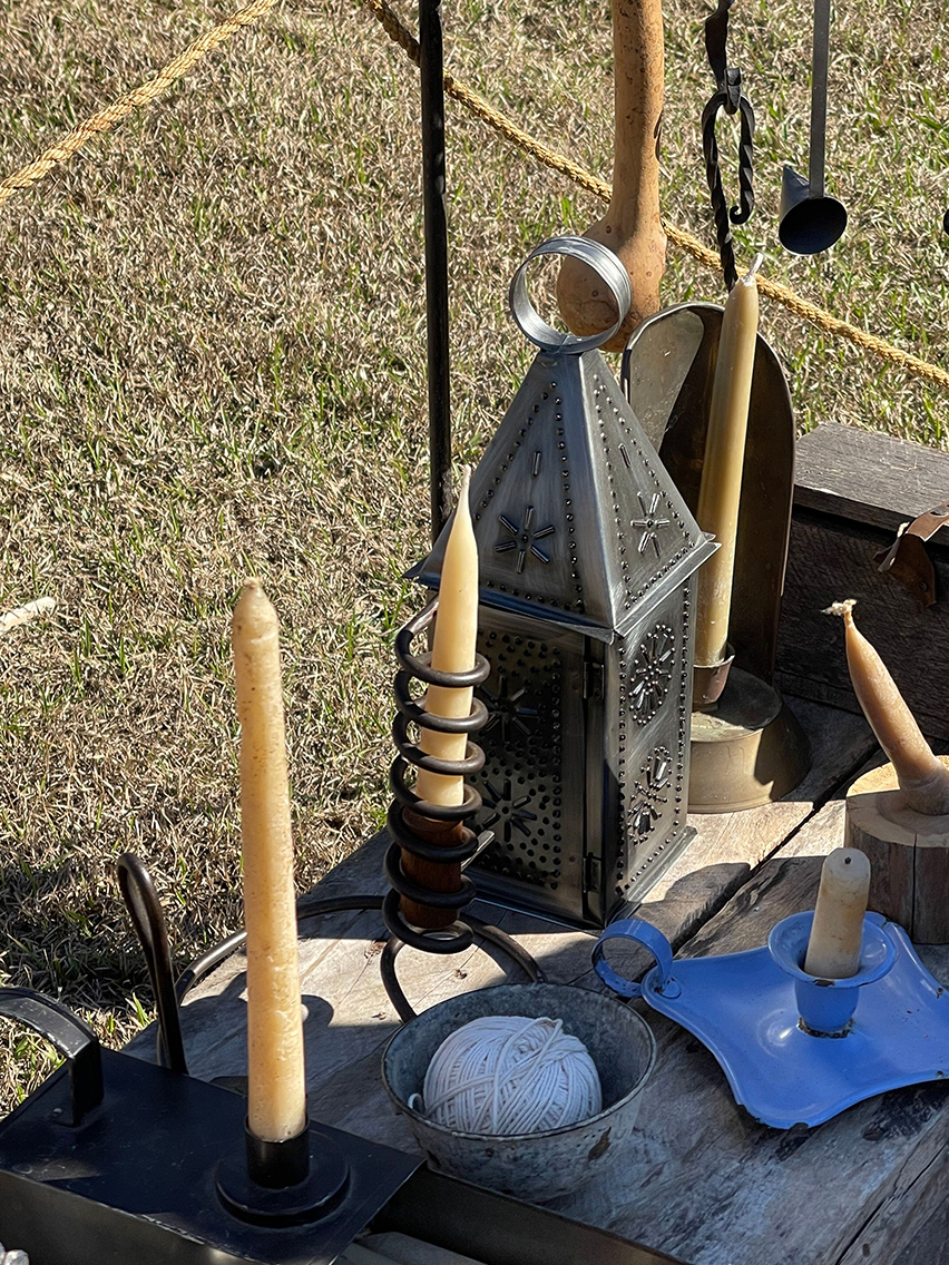 *7) More of her work is shown with some antique candle holders