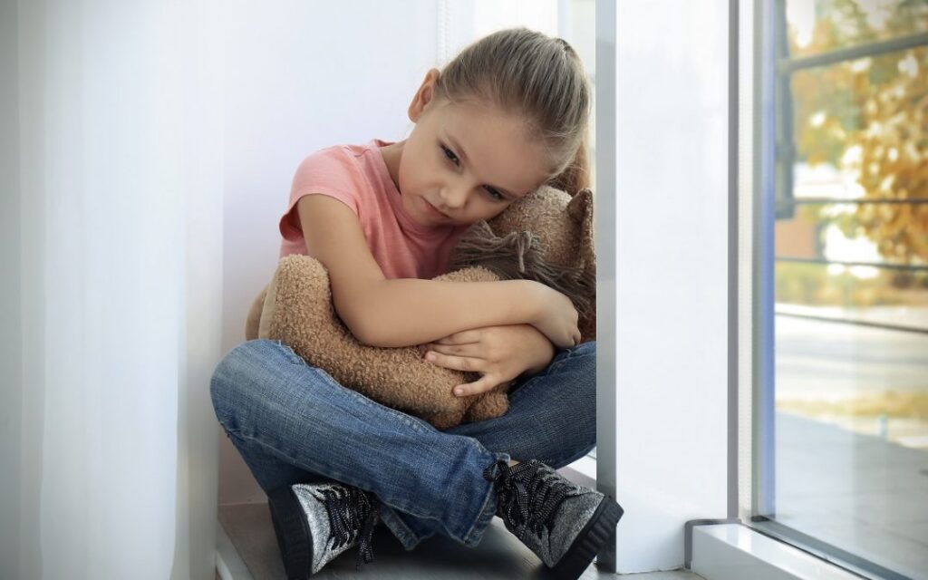 Child and teddy bear